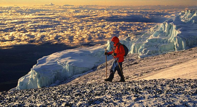 2-slide-kilimanjaro-trek-climber-pano